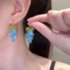 Icy blue grape earrings, copper alloy cluster earrings, light luxury fashion jewelry, versatile dangle earrings, advanced design ear accessories, hypoallergenic statement earrings, nature-inspired earrings, bohemian chic jewelry, gift for her, lightweight earrings, gold-toned earrings, handcrafted ear jewelry, elegant bead earrings, daily wear earrings, special occasion accessories, affordable luxury earrings, unique design earrings, fashion statement earrings, sophisticated ear accessories, wardrobe staple earrings.