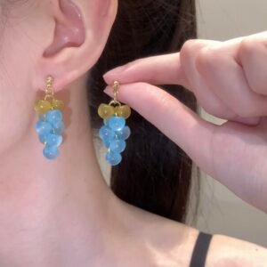 Icy blue grape earrings, copper alloy cluster earrings, light luxury fashion jewelry, versatile dangle earrings, advanced design ear accessories, hypoallergenic statement earrings, nature-inspired earrings, bohemian chic jewelry, gift for her, lightweight earrings, gold-toned earrings, handcrafted ear jewelry, elegant bead earrings, daily wear earrings, special occasion accessories, affordable luxury earrings, unique design earrings, fashion statement earrings, sophisticated ear accessories, wardrobe staple earrings.
