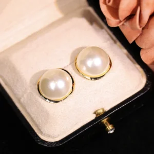 Dust whisper earrings, copper alloy pearl studs, light luxury minimalist earrings, gold-toned elegant accessories, hypoallergenic stud earrings, versatile daily wear earrings, faux-pearl jewelry, secure clutch earrings, nickel-free earrings, tarnish-resistant copper alloy, timeless design earrings, subtle sophistication jewelry, gift-ready earrings, black velvet packaging, romantic luxury accessories, symmetrical pearl studs, lightweight comfortable earrings, wardrobe staple earrings, affordable luxury jewelry, classic pearl accents.