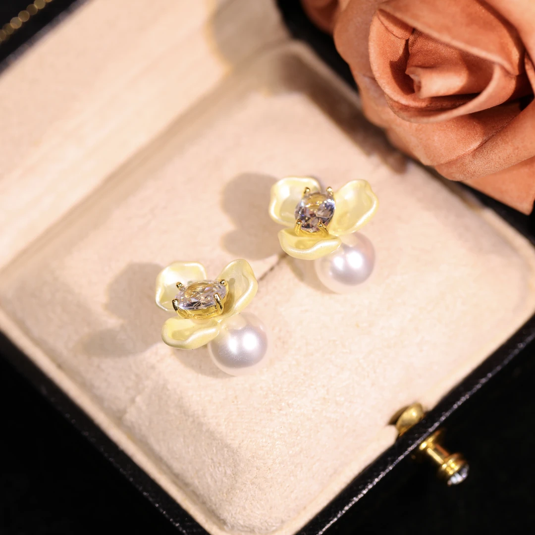 Copper-alloy floral earrings, Among the Blossoms earrings, light luxury jewelry, pearl accent earrings, versatile women's earrings, hypoallergenic earrings, gold-toned floral design, romantic earrings, elegant gift idea, fashion accessories, daily wear earrings, special occasion jewelry, affordable luxury, nickel-free earrings, tarnish-resistant jewelry, artistic design earrings, modern floral earrings, lightweight statement earrings, women's fashion gifts, blooming garden inspiration.