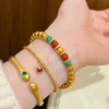 Chinese Style Gold Pumpkin Bead Bracelet Set Stacked on Wrist