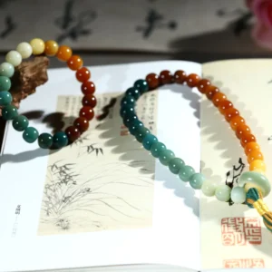 Multi-Color Bodhi Bracelet with Tassel on Open Book