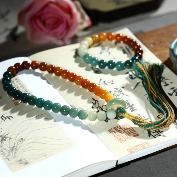 Gradient Color Bodhi Bracelet with Multi-Color Barrel Beads on Book with Calligraphy