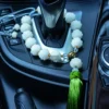 Lotus Mala Hanging from Car Gear Shift with Green Tassel
