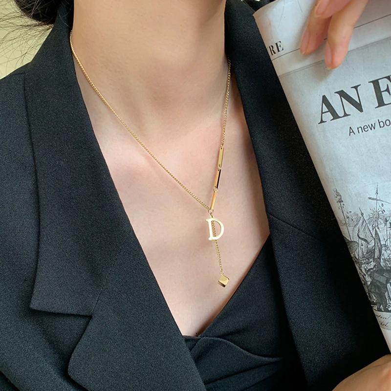 Titanium steel letter D necklace, Korean style tassel chain, adjustable 40+5cm lock-neck jewelry, fade-proof collarbone accessory, JIN BAI ZHENG brand, hypoallergenic women's necklace, versatile daily wear, minimalist gift idea, sustainable materials, affordable luxury, artisan crafted, positive energy accessory, modern feminine style, special occasion gift, holistic wellness jewelry, cultural inspired design, elegant packaging.