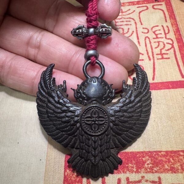 Tibetan thogcha iron pendant, Garuda protector amulet, celestial iron jewelry, traditional Tibetan craftsmanship, adjustable cord necklace, spiritual protection amulet, handmade ethnic jewelry, Buddhist symbolic pendant, cold iron thogcha artifact, Himalayan cultural accessory, antique finish pendant, negative energy ward, unisex spiritual gift, minimalist sacred design, ethical sourcing, holistic wellness jewelry, mystical Tibetan symbols, artisan crafted pendant, daily wear talisman, cultural heritage gift.