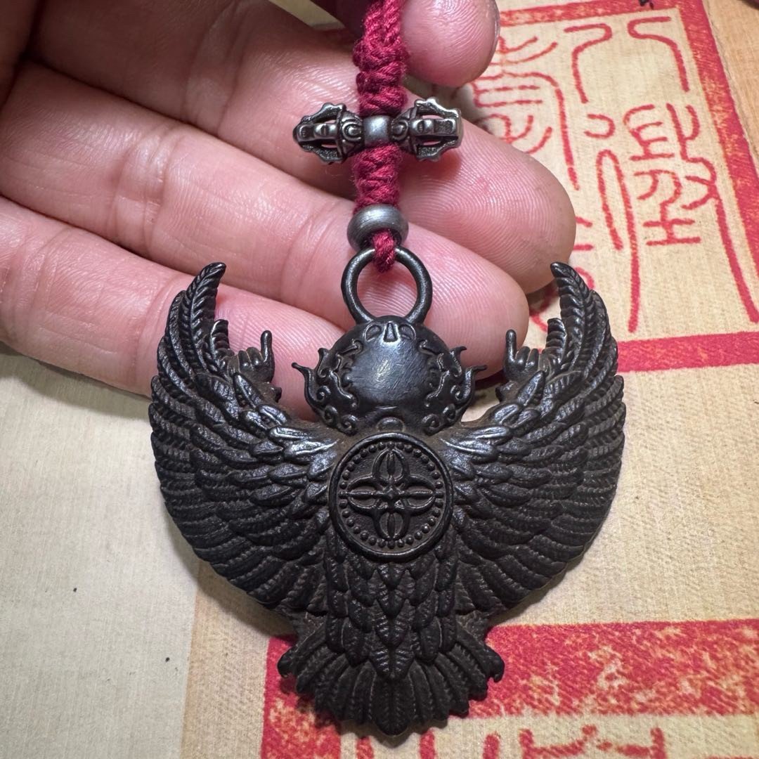 Tibetan thogcha iron pendant, Garuda protector amulet, celestial iron jewelry, traditional Tibetan craftsmanship, adjustable cord necklace, spiritual protection amulet, handmade ethnic jewelry, Buddhist symbolic pendant, cold iron thogcha artifact, Himalayan cultural accessory, antique finish pendant, negative energy ward, unisex spiritual gift, minimalist sacred design, ethical sourcing, holistic wellness jewelry, mystical Tibetan symbols, artisan crafted pendant, daily wear talisman, cultural heritage gift.