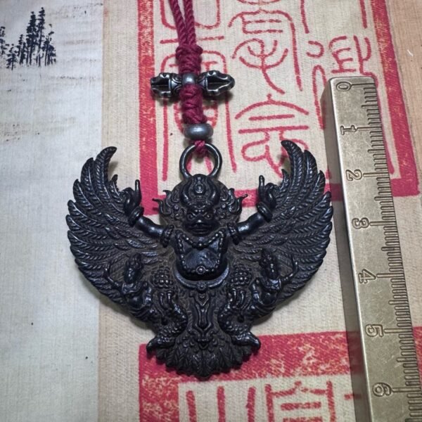 Tibetan thogcha iron pendant, Garuda protector amulet, celestial iron jewelry, traditional Tibetan craftsmanship, adjustable cord necklace, spiritual protection amulet, handmade ethnic jewelry, Buddhist symbolic pendant, cold iron thogcha artifact, Himalayan cultural accessory, antique finish pendant, negative energy ward, unisex spiritual gift, minimalist sacred design, ethical sourcing, holistic wellness jewelry, mystical Tibetan symbols, artisan crafted pendant, daily wear talisman, cultural heritage gift.