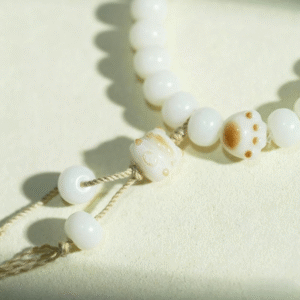 Close-up of Cat Paw Charm on Bodhi Bead Bracelet