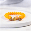 Close-up of Special Charms on Yellow Bodhi Abacus Bead Bracelet