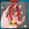 Close-up of Red Bodhi Bracelet with Crystal Bead and Gold Accents