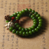 White Jade Bodhi Bracelet with Lotus Flower on Antique Paper