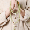 Two Hands Holding 108-Bead Celadon Bodhi Mala in Prayer Position