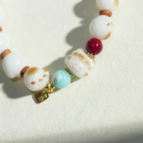 Natural White Bodhi Bracelet with Cat Paw Charm and Red/Blue Beads