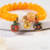Yellow Abacus Bodhi Bracelet on White Fabric with Decorative Flower