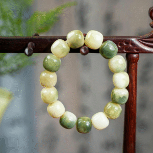 Chinese Style Green Bodhi Barrel Bead Bracelet on Wooden Stand