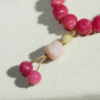 Close-up of Detailed Cat Paw Charm on Pink Bodhi Bracelet