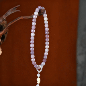 Butterfly Fairy Bodhi Bracelet Hanging from Branch with Gray Tassel