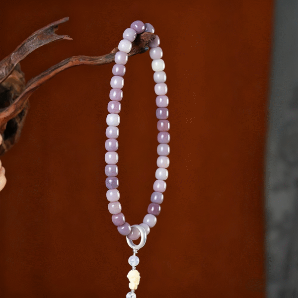 Butterfly Fairy Bodhi Bracelet Hanging from Branch with Gray Tassel
