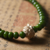 Buddhist Prayer Bracelet with Seedpod Charm on Sealed Document