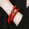 Red Double Strand Bodhi Bracelet on Wrist with Detailed Buckle Bead