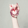 Hand Holding Purple Bodhi Bracelet with Lotus Decoration
