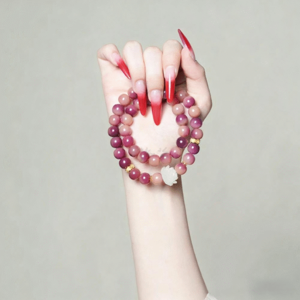 Hand Holding Purple Bodhi Bracelet with Lotus Decoration