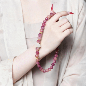 Wrist Wearing Purple Double Strand Bracelet with Red Nails and Traditional Sleeve