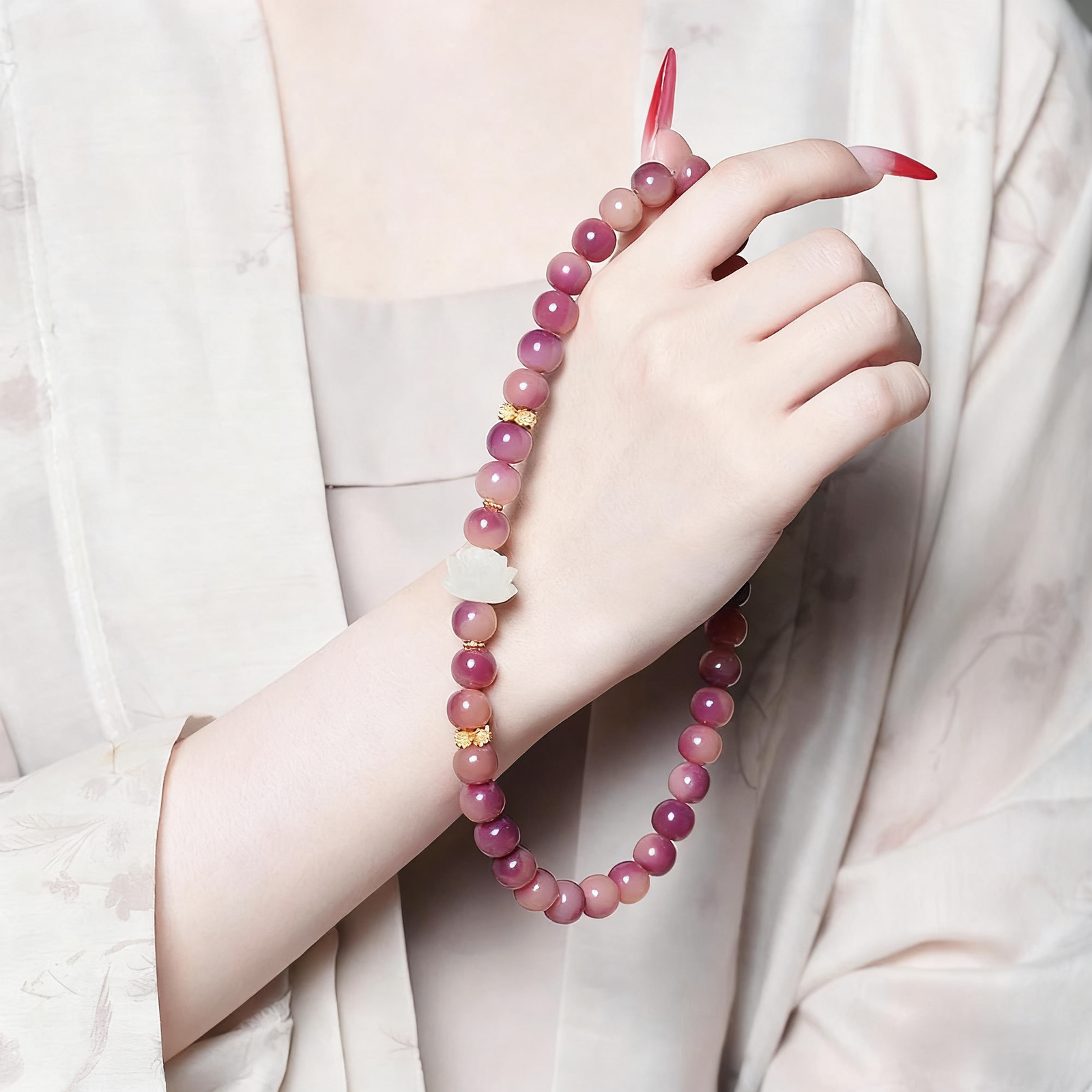 Wrist Wearing Purple Double Strand Bracelet with Red Nails and Traditional Sleeve