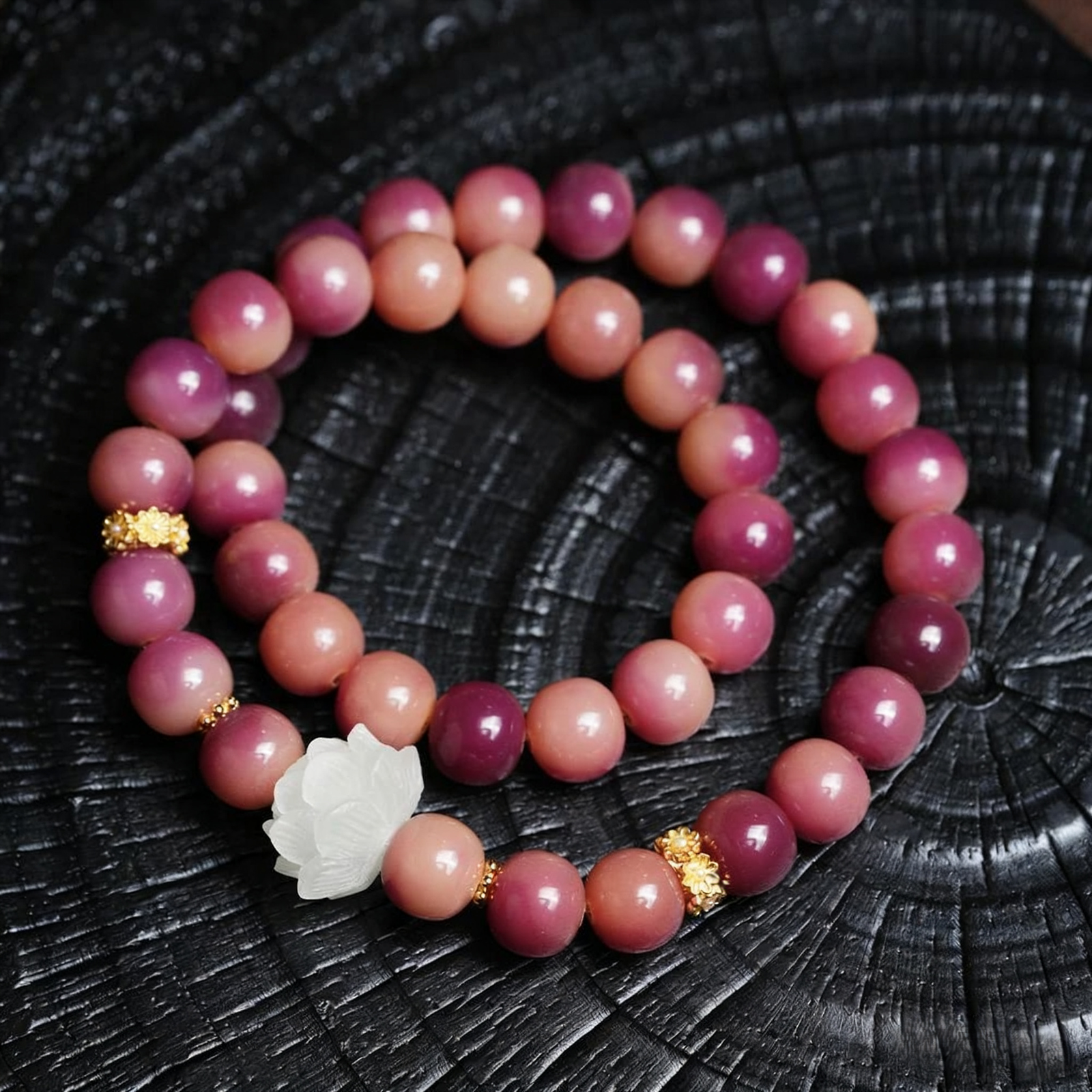 Close-up of Purple Bodhi Bracelet with Gold Accents on Black Background