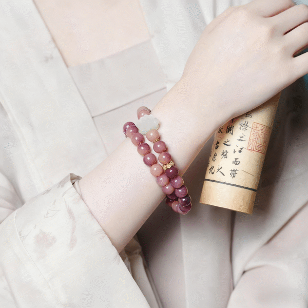 Woman Wearing Purple Double Strand Bodhi Bracelet with Lotus Charm and Scroll