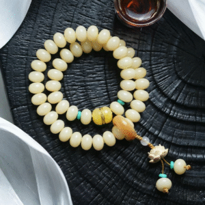 Hand Holding Double Strand Bodhi Bracelet with Lotus Charm and Multi-Color Beads