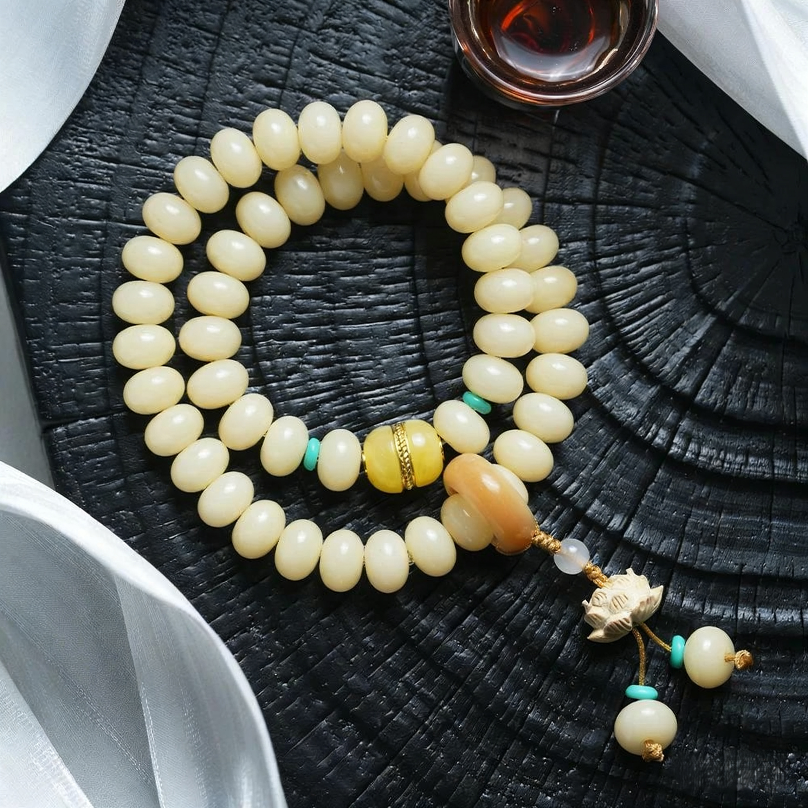  Hand Holding Double Strand Bodhi Bracelet with Lotus Charm and Multi-Color Beads