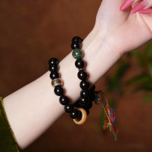 Wrist Wearing Purple Gold Bodhi Bracelet with Green Bead