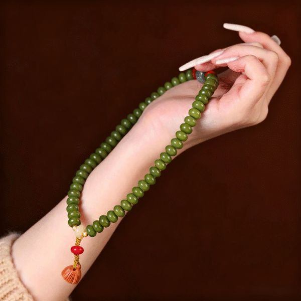 Double Strand Green Bodhi Seed Bracelet held in Hand