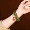 Double Strand Green Bodhi Bead Bracelet with Lotus Tassel on Wrist