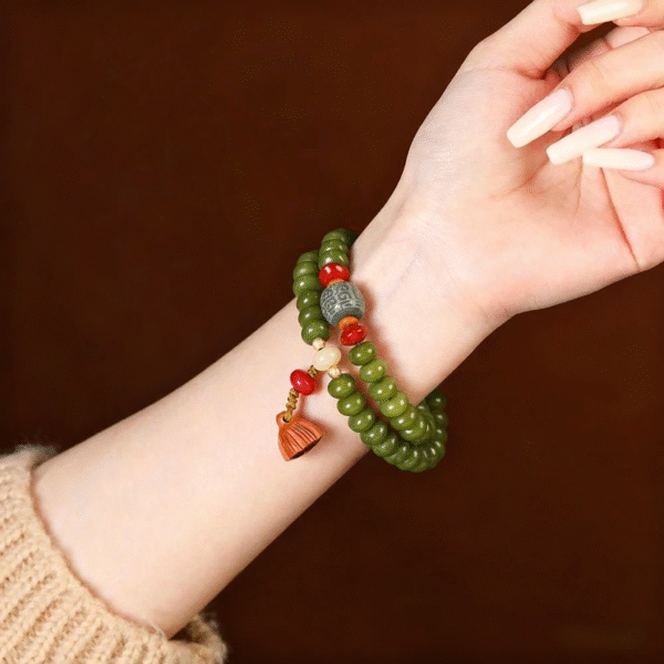 Double Strand Green Bodhi Bead Bracelet with Lotus Tassel on Wrist