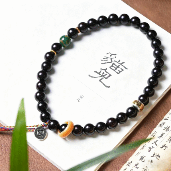 Purple Gold Bodhi Bracelet on Book with Chinese Characters