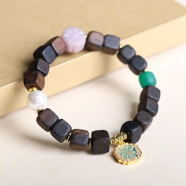 Dalargan agarwood bracelet, 11mm agarwood beads, natural fragrant wood jewelry, meditation aromatherapy bracelet, spiritual grounding accessory, sustainable luxury bracelet, therapeutic scent beads, ethical agarwood sourcing, mental clarity bracelet, resin-rich agarwood, artisan wood craft, daily mindfulness beads, spiritual gift idea, holistic lifestyle accessory, premium Dalargan wood, aromatic prayer beads, natural grain variations, eco-friendly spiritual wear, luxury wood bracelet, wellness jewelry.