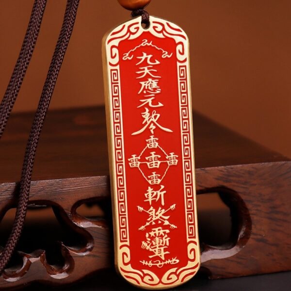 Thunder Command Amulet with red gold design