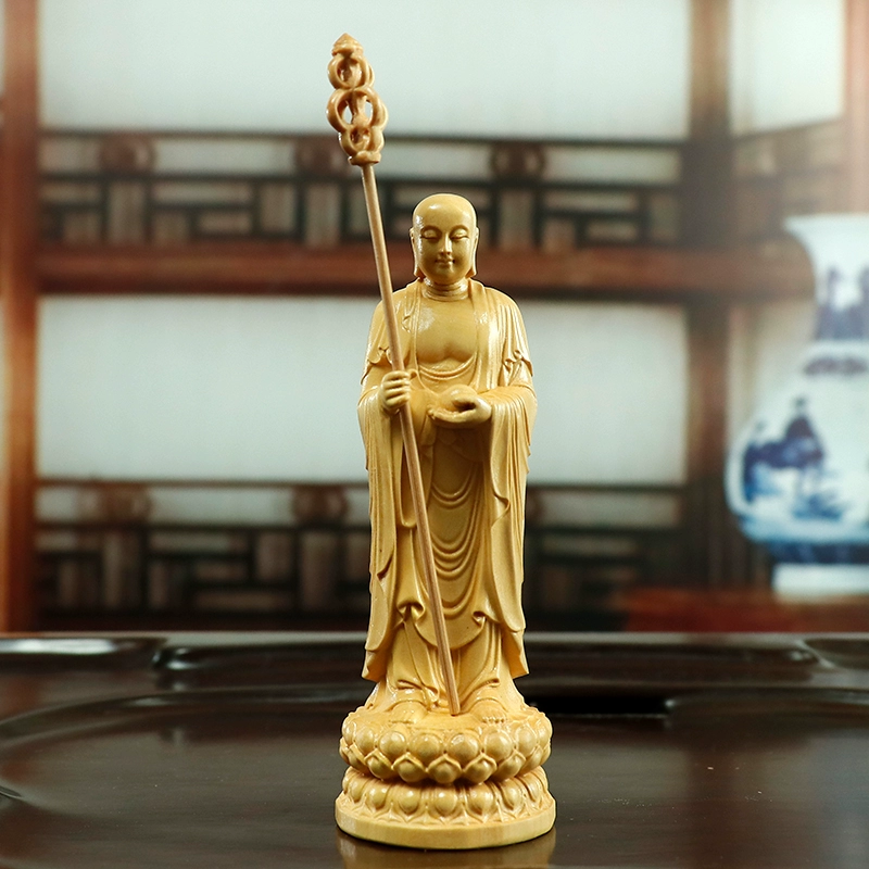Boxwood Dizang Bodhisattva statue, hand-carved Buddhist altar ornament, 21cm standing Ksitigarbha, sustainable wood carving, detailed robe sculpture, lotus base statue, spiritual decor, traditional craftsmanship, eco-friendly religious art, meditation space centerpiece, cultural gift idea, serene Bodhisattva carving, home temple accessory, artisan woodwork, mindfulness symbol, ethical sourcing, Zen inspiration, collector’s spiritual art, compact altar statue, symbolic Buddhist gift. 